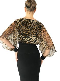 "Our fabulous Mariposa butterfly top in Golden Brown Cheetah chiffon. Open long sleeves will keep you cool. Sophistication at it's finest. Flowing chiffon floats over a stretch jersey shell. Fabric & Care: -Easy care, no-wrinkle poly/spandex -Hand wash cold. Hang dry. Overview: -Great for travel - lightweight and rolls up small. -Handmade in our studio in Santa Fe, New Mexico USA. Questions about fabric, fit or size? Email me. I am delighted to help. Size Bust Waist Hip 4 32\" - 34\" 24\" - Fitted Chiffon Blouse For Evening, Fitted Chiffon Evening Blouse, Flowy Chiffon Evening Tops, Flowy Chiffon Top For Evening, Tango Pants, Mariposa Butterfly, Green Sand, New Mexico Usa, Wrap Pants