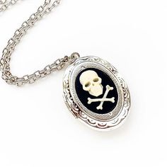 Skull Cameo Locket Necklace Skull and Crossbones Jewelry Gothic Jewelry With Skull Print For Gift, Metal Skull Print Necklace For Gift, Skull Print Metal Necklace For Gift, Vintage Engraved Jewelry For Halloween, Halloween Skull Jewelry With Engraving, Halloween Skull Jewelry Engraved, Skull-shaped Bone Jewelry For Gifts, Skull Shaped Bone Colored Jewelry For Gifts, Halloween Skull-shaped Engraved Jewelry