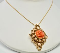 "Pink Brooch, Pink Pendant, Angel Skin Coral Brooch, Pink Coral Pendant, & Red Coral, Sea Coral, Cultured Pearls, Rose Pendant, Rose Brooch, Floral Pendant, Floral Brooch, Convertible Brooch/ Pendant, 14K Gold. This gorgeous vintage Brooch is finely crafted in solid 14K Yellow gold (stamped and also carefully tested and guaranteed). The center beautiful carved coral flower measures 16mm. It is complimented with ten Angel skin pearls of 3mm and two corals of 4mm. Two 2mm each cultured pearls Rose Colored Wedding Brooch Jewelry, Rose Coral Jewellery, Coral Pendants Gold, Elegant Flower Pendant Brooch, Coral Rose Necklace, Vintage Coral Oval Jewelry, Pink Brooch, Tiffany Earrings, Sea Coral