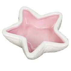 a white and pink star shaped bowl on a white background