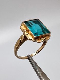 Vintage 10K Yellow Gold Turquoise stone Woman's ring Cubic Zirconia Stone - has light scratches Size 7 1.5dwt Emerald Cut Turquoise Gemstone Jewelry, Turquoise Emerald Cut Gemstone Jewelry, Heirloom Turquoise Rings Hallmarked, Formal 14k Gold Turquoise Ring Fine Jewelry, Formal 14k Gold Turquoise Ring, Turquoise Gemstone Rings With Emerald Cut, Emerald Cut Turquoise Gemstone Ring, Turquoise Emerald Cut Gemstone Ring, Turquoise Emerald-cut Gemstone Ring