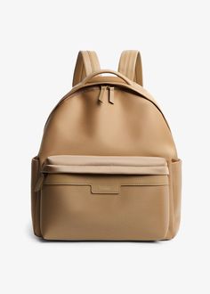 a tan leather backpack on a white background