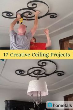 two men working on the ceiling in their living room, and one is using a light fixture