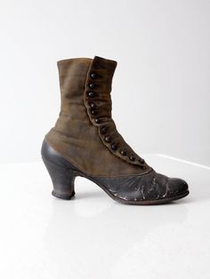 This is a pair of late Victorian era boots. Beautifully aged, two tone leather shapes the button up boots. They feature wood stacked heels.late 1800s to early 1900s.  • two tone leather shoes• button up boots• wood stacked heelsCONDITIONIn good condition with wear consistent with age and use.  A button is missing on one of the boots. The soles have worn holes and the leather has some cracking on the boots.MEASUREMENTSOutSole Length:  10.25" ... 26 cmWidth:  2.875" ... 7.3 cmHeel Height:  2.5" .. Leather Cap Toe Boots With Buttons, Victorian Boots With Leather Sole, Vintage High Heeled Boots With Leather Sole, Vintage Heeled Boots With Leather Sole, Vintage High Heel Boots With Leather Sole, Victorian Boots With Leather Sole For Fall, Vintage Heeled Boots With Leather Sole For Fall, Vintage Leather Boots With Buttons, Vintage Heeled Boots With Leather Sole And Almond Toe