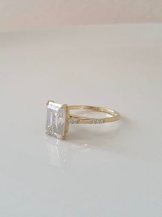 an engagement ring with a princess cut diamond