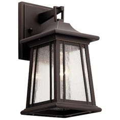 an outdoor wall light with frosted glass on the front and side panels, in dark bronze finish