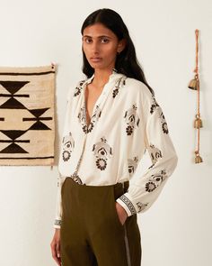 Rendered in block-printed cotton, our floral print shirt has a notched collar and relaxed fit. Dropped at the shoulders, the shirt lightly gathers at the cuffs. The lightweight shirt has a sheer texture in the swaths of white. Works well tucked or untucked. For a more dramatic sleeve, try the Poet Blouse. This one-of-a-kind textile was woven by hand. Subtle variations are part of the unique beauty of the garment and a signature of the artisan's hand. Sheer Texture, Alix Of Bohemia, Poet Blouse, Dramatic Sleeves, Embroidery Print, Structured Jacket, Tencel Fabric, The Poet, Holiday Party Outfit