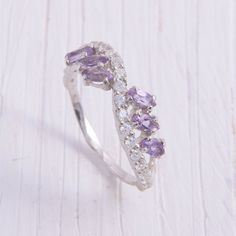 Amethyst ring, Wedding band silver, Wedding ring for her, Women wedding ring, Marquise ring, February birthstone, Unique wedding band WE OFFER UNLIMITED PERIOD INSTALLMENTS PLAN This is a beautiful, stunning, feminine ring that works well for all occasions, styles, and ages. You will love it! Ring information: Main stones: Amethyst Approximate size: 4*2mm (6 stones) Accents stones: White cubic zirconia Approximate size: 1.5mm (21 stones) Metal type: Silver Metal stamp: 925 Sterling Silver Instal Lilac Wedding Ring, Rose Gold Cz Ring, Wedding Ring Marquise, Wedding Band Silver, Cute Promise Rings, Women Wedding Ring, Amethyst Engagement Ring, Fantasy Ring, Unique Wedding Band