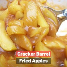 there is a spoon full of food with the words cracker barrel fried apples