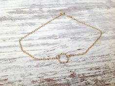 "This tiny gold circle bracelet is a delicate bracelet made with a beautiful 14k gold filled circle tiny ring connector . It is a tiny, delicate and dainty bracelet. This romantic gold bracelet is perfect for giving to a special someone or as a gift to yourself. You can wear the bracelet on the arm or leg. Made from 14k goldfilled (chain and pendant). Bracelet Measures Approximately 7\"- as default Please select a size from the options If you would like this chain altered, please convo me . All Dainty Jewelry With Delicate Open Circle Chain, Dainty Open Circle Jewelry With Delicate Chain, Dainty Delicate Chain Jewelry, Dainty 14k Gold Filled Circular Jewelry, Hypoallergenic Dainty Open Circle Jewelry, Handmade Dainty Circle Jewelry, Handmade Dainty Circular Jewelry, Tiny Bracelet, Karma Bracelet