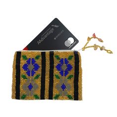 Beautifully hand-loomed of solid Czech seed beads, this charming coin purse makes a great gift. Each coin purse is fabric-lined with a zipper closing. The coin purses are hand-loomed by artisans in Guatemala and imported with Fair Trade practices. Perfect for holding ID/Credit Cards.* 4.5 in x 3 in x 0.25 in* Handmade in Guatemala* Made following Fair Trade guidelines Beaded Multicolor Coin Purse Gift, Beaded Pouch Coin Purse Gift, Beaded Pouch Coin Purse As Gift, Rectangular Beaded Coin Purse For Gift, Rectangular Beaded Coin Purse As Gift, Beaded Pouch Coin Purse For Gift, Gift Woven Pouch, Rectangular Handwoven Pouch For Gifts, Rectangular Handwoven Pouch As Gift