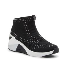 Skechers-Hands Free Slip-Ins: A Wedge Sneaker Bootie Complete with sleek accents and a sporty style, the Hands Free Slip-Ins: A Wedge sneaker bootie from Skechers will liven up any casual look. This simple silhouette is crafted with silvertone studs and metallic accents that polish up the pair. Complete with maximum cushioning and a lace-free closure that makes these kicks comfortable and easy to wear. Sporty Mid-top Synthetic Wedge Sneakers, Sporty Wedge Sneakers For Sports, Sporty Wedge Heel Sneakers For Sports, Slip-on Synthetic Wedge Sneakers For Sports, Modern Synthetic Wedge Sneakers For Sports, Black Synthetic Sporty Wedge Sneakers, Black Sporty Synthetic Wedge Sneakers, Black Synthetic Wedge Sneakers, Simple Silhouette