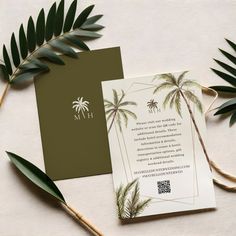 the wedding stationery is decorated with palm trees and greenery, along with an envelope