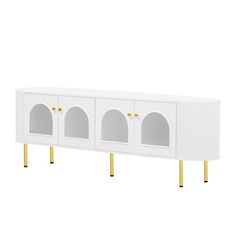 a white cabinet with gold legs and two doors on each side, in front of a white background