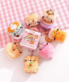 some cute little food items are on a pink and white checkered tablecloths