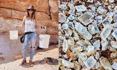 a woman standing next to a pile of rocks and buckets filled with ice cubes