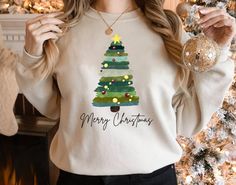 "Watercolor Christmas Tree Shirt, Watercolor Pine Tree T Shirt, Christmas Shirts for Women, Womens Christmas Tree Shirt,Christmas Party Shirt Please Check All Photos For Details.   🐞Choose Your T-Shirt Size From The Drop-Down Lists Next To The item Picture   ⭐Choose Of Your T-Shirt Color From The 2nd Picture   🐞Use \"Add message to Seller\" link On The Checkout Page To Send me the Following important Details For Your Order's Customization.   ⭐Shipping Time Varies by location (we are located in Sugar Land, Texas) please consider that our turn around time is 1 to 3 business days.     ⭐Which brand do you use for t-shirts? We use Gildan Softstyle, Bella Canvas Unisex, Hanes, Outlash, Tees,  District and Next Level when we have a shortage of stocks for certain colors and sizes. Our printing m Watercolor Pine Tree, Tree T Shirt, Christmas Shirts For Women, Bridesmaid Groomsmen, Christmas Party Shirt, Watercolor Christmas Tree, Christmas Engagement, Christmas Party Shirts, Womens Christmas