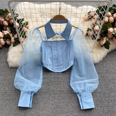 Detachable lapel shirt, stitching puffer sleeves short chic blouseMaterial:blendedColor:white,black ,blue,apricotStyle:sexyFeatures:puffer sleeveSize(CM):freelength:24,bust:60-80,waist:60-70,sleeve:60&ltp&gtNote:Due to different measurement methods,there will be 1-3 error(unite:cm), please understand.</p>&ltbr/> Shirt With Poofy Sleeves, Shirts With Puffy Sleeves, Chic Fitted Blouse With Doll Collar, Trendy Fitted Patchwork Blouse, Fitted Long Sleeve Blouse With Splicing, Fitted Spliced Blouse For Summer, Fitted Splicing Blouse For Summer, Chic Spring Tops With Doll Collar, Chic Doll Collar Tops For Spring