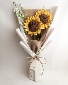 a bouquet of sunflowers wrapped in burlock