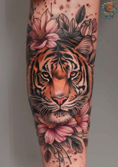 a tiger with flowers on its leg and it's face in the middle of the thigh