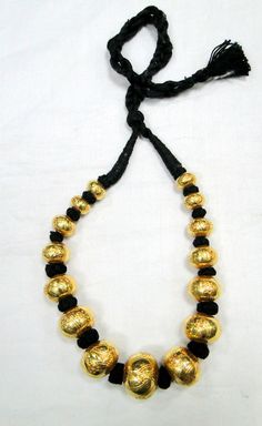 22 K gold Large beads Necklace. Handmade beautiful hollow Gold beads filled with wax inside to give more strength and durability. Good for wear as is or for your own creation. Length-27 cm ( free size easy to adjust the length by pulling the toggle), size of center bead-15/20 MM, Weight-77 grams. Material-22 K gold. Gold Dual-tone Temple Necklace For Puja, Bollywood Style Dual-tone Gold Temple Necklace, Gold Dual-tone Temple Necklace For Diwali, Traditional Yellow Gold Dual-tone Necklaces, Dual-tone Gold Temple Necklace For Diwali, Traditional Gold Dual-tone Temple Necklace, Dual-tone Gold Necklaces For Navratri, Gold Dual-tone Necklace For Navratri, Gold Dual-tone Bollywood Necklace