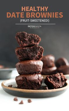 chocolate brownies stacked on top of each other with text overlay that reads healthy date brownies fruit - sweetened