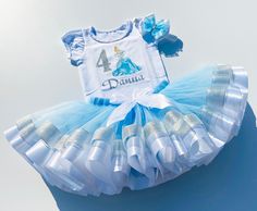 I offer you a beautiful outfit in the style of Princess Cinderella. NOTES FOR THE SELLER -Number for personalizing the top. -Name to personalize the vertex. -Need by date. Sleeve for the top - short, long. TOP. The top of it is 100% cotton. Size 3-24 months it is a bodysuit, 2T-10T it is a shirt. (Since it is more handmade always remember the shirt needs to be washed inside out, hand washed and air dried). SKIRT - made of soft tulle, edged at the bottom with a ribbon and decorated with a bow. Tu Princess Style White Sets For First Birthday, White Princess Style First Birthday Set, White Princess Sets For First Birthday, White Fitted Princess Style Set, Princess Birthday Outfit, Cinderella Tutu, Frozen Outfits, Dress Birthday Party, Cinderella Birthday