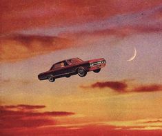 an old car flying through the sky at sunset with a crescent moon in the background