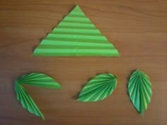 the paper is cut out to look like a christmas tree and two palm leaf shapes