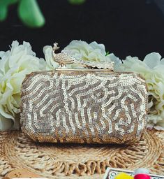 This stunning Party Clutch Bag is embellished with sequin work on a gold silk Base . This Minaudière Clutch is ideal for parties and weddings and any festive occasion. This Handmade Embroidered Embellished Sling Purse can be used with or without the metal sling that is included. Dazzle through the Day or Evening with this beautifully Handcrafted Wedding Bridal Clutch Bag. Perfect for a Bride, Bridal Gift, Bridal Clutch, Wedding Clutch, Mehndi, Nikaah, Shaadi, Sangeet, Indian and Pakistani events Festive Sequined Bags For Reception, Glamorous Embellished Potli Bag For Reception, Rectangular Gold Embroidered Evening Bag For Receptions, Hand Embellished Potli Bag For Festival Celebrations, Hand Embellished Potli Bag For Festivals, Festive Gold Hand Embellished Bag, Festive Hand Embellished Gold Bag, Festive Gold Hand-embellished Bag, Glamorous Embellished Potli Bag For Festive Occasions