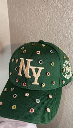 Adjustable NY Custom Bedazzled Hat customed by ShanayCosmetics Comes in 4 colors: Black-Green-Denim-Pink PLEASE KEEP IN MIND THAT I AM NOT RESPONSIBLE FOR ANY DELAYS WITH SHIPPING ONCE I HAVE DROPPED YOUR PACKAGE OFF AT THE POST OFFICE! THAT IS OUT OF MY CONTROL. PLEASE BE AWARE I AM NOT RESPONSIBLE FOR ANY LOST, DAMAGED OR STOLEN PACKAGES!! Trendy Rhinestone Hats For Spring, Trendy Snapback Baseball Cap With Rhinestones, Trendy Rhinestone Snapback Baseball Cap, Trendy Rhinestone Baseball Cap, Trendy Rhinestone-embellished Cap, Trendy Rhinestone Cap, Trendy Snapback Hat With Rhinestones, Green Ny Hat, Bedazzled Hat