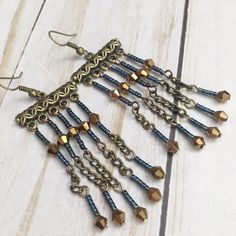 Amazing Metallic Blue And Bronze Bohemian Beaded Fringe Earrings By Jules Jewelry Box. Earrings Measure Approx 3 Inches Long. Beautiful, Beaded Pattern, Flirty Style Handcrafted By Jules Jewelry Box! Blue Metal Beaded Drop Earrings, Blue Metal Beaded Dangle Earrings, Blue Metal Beaded Earrings For Gift, Blue Metal Beaded Earrings, Handmade Blue Beaded Metal Earrings, Blue Metal Beaded Earrings For Party, Blue Beaded Metal Earrings, Blue Beaded Metal Chandelier Earrings, Blue Metal Earrings With Dangling Beads