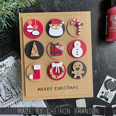 a christmas card with buttons on it and some other items next to it, along with an ornament