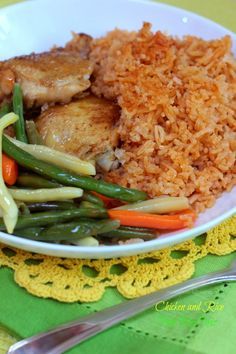 a white plate topped with rice and green beans