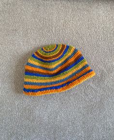 Vintage Colourful Hand Knit Wool Hat. Really cool and unique. Thick and sturdy wool. Quite thick and would keep you warm. such a funky, boho style. could be a little itchy on sensitive skin.  MEASUREMENTS:  width: 26cm  height: 19cm circumference: 58cm  CONDITION  The hat is in good condition however it is vintage and handmade so bear that in mind before buying. There maybe some defects I've missed when looking it over Bohemian Knit Hats For Fall, Handmade Bohemian Hats In Acrylic Yarn, Bohemian Hats For Cold Weather And Fall, Warm Bohemian Hat For Fall, Fall Bohemian Knitted Hats, Handmade Bohemian Beanie From Yarn, Bohemian Hats For Cold Weather, Bohemian Style Hats For Cold Weather, Bohemian Knitted Hats For Cold Weather