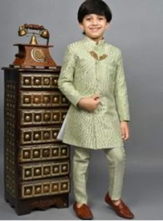 Pls Check The Size Chart before placing the Order  Kids Indo-western Sherwani And Dhoti In Blue  * Style - Kids Indo-western Sherwani * Fabric - Premium Silk Blend * Color - Yellow/Green/Beige * Work Type - Embroidered , Mandarin Collar, Straight Cut Style * Bottom - Paired with Matching Silk Pant Embroidered Gold Bandhgala For Navratri, Festive Embroidered Pista Green Nehru Jacket, Festive Pista Green Embroidered Nehru Jacket, Festive Pista Green Nehru Jacket With Traditional Drape, Festive Pista Green Bandhgala With Resham Embroidery, Pista Green Nehru Jacket With Zari Work For Eid, Party Nehru Jacket With Zari Work For Festivals, Festive Nehru Jacket With Zari Work For Parties, Nehru Jacket With Zari Work For Party And Festivals