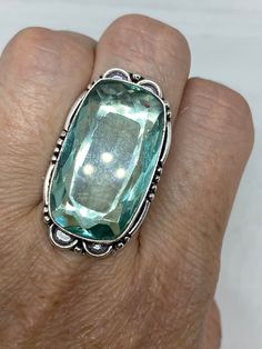 Large brilliant aqua antique glass Ornate German Silver Vintage ring, does not tarnish Size 7.25 My jeweler will re size for a $10-$20 fee All rings are shipped in a nice gift box. Check out our over a THOUSAND great reviews Engraving is $4 per letter and is not always perfect depending on the piece. It can take a few days if the jeweler is busy. This is payable to Paypal Judithsltd@gmail.com Vintage Silver Crystal Ring With Large Stone, Rectangular Aquamarine Silver Ring, Antique Green Turquoise Ring As Gift, Handmade Turquoise Aquamarine Ring, Green Aquamarine Ring For Gift, Green Aquamarine Rings As A Gift, Green Aquamarine Rings For Gifts, Vintage Aquamarine Jewelry For Gift, Vintage Aquamarine Gemstone Jewelry