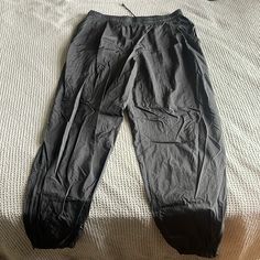 Nike Track Pants/Jogger Large Baggy Fit, Tampered Bottom Black Never Worn Obo Nike Casual Pants With Cargo Pockets, Nike Bottoms With Side Pockets For Loungewear, Nike Trousers With Side Pockets, Nike Athleisure Cargo Pants With Elastic Waistband, Nike Athleisure Cargo Pants, Nike Joggers With Side Pockets, Nike Tapered Leg Bottoms With Pockets, Nike Cargo Pants With Side Pockets, Nike Tapered Leg Athleisure Bottoms