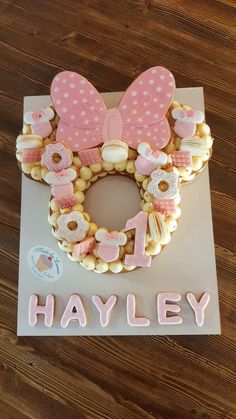 a minnie mouse cookie with the word h is for hayley