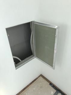 an open window in the corner of a room