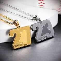 two necklaces with the number twenty and one is made out of gold, silver or bronze