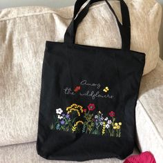 "🌸 Each design on the tote bag is stitched entirely by hand. The embroidered tote bag is sewn from natural and environmentally friendly linen. The floral tote bag has a lining. This tote bag is very capacious and practical. 🌸 Material: Linen 🌸 Measurements:  🍀 Among wildflower bag: 14\" x 11\" x 3-1/2\"  + Handle length: 22 inches 🌸 Care instructions for linen tote bag: hand washing / delicate washing at temperature 30oС (or 86 ºF) 🌸 Please note that colors may look slightly different due to computer monitor settings and lighting. 🌸 Thanks for visiting my little shop, located in Pittsburgh, PA! Please do not hesitate to contact me if I could further assist/information on this item." Everyday Embroidered Canvas Bag, Embroidered Canvas Bag For Everyday, Floral Embroidered Canvas Tote Bag For Everyday Use, Embroidered Cotton Shoulder Bag For Everyday Use, Daily Use Cotton Canvas Bag With Floral Embroidery, Everyday Embroidered Cotton Bag, Everyday Cotton Bag With Embroidery, Everyday Embroidered Canvas Tote Bag, Spring Embroidered Cotton Shoulder Bag