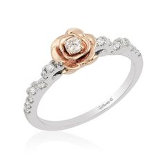 a rose ring with diamonds on it