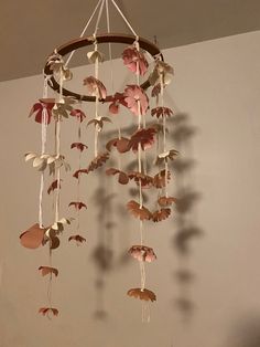 a wind chime with leaves hanging from it