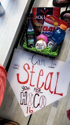 a sign that reads can't steal you for hoco is sitting on a picnic table