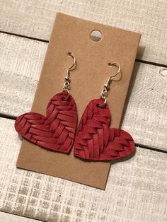 Red Heart Fishtail Weave Leather Earrings Dimensions: Heart 1 1/2" X 1 1/2" Color:  red Hardware is stainless steel and is nickel and lead free. *Back side or suede back color on this leather may change from dye lot to dye lot. ** Each piece is unique, so expect slight differences from the piece pictured. Adjustable Red Heart Earrings For Gift, Red Leather Earrings For Gifts, Adjustable Red Leather Earrings, Handmade Red Heart Earrings, Heart-shaped Leather Jewelry For Gifts, Heart-shaped Leather Jewelry Gift, Red Leather Jewelry For Gifts, Red Leather Jewelry For Gift, Red Leather Earrings