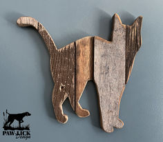 a cat and dog shaped wooden wall hangings