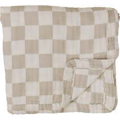 the checkered blanket is folded on top of it