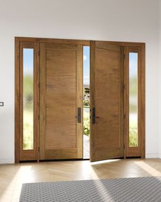 two wooden doors open in an empty room with wood flooring and tile on the floor