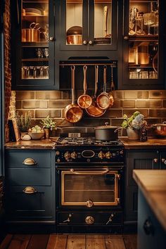 an old fashioned kitchen with pots and pans on the stove